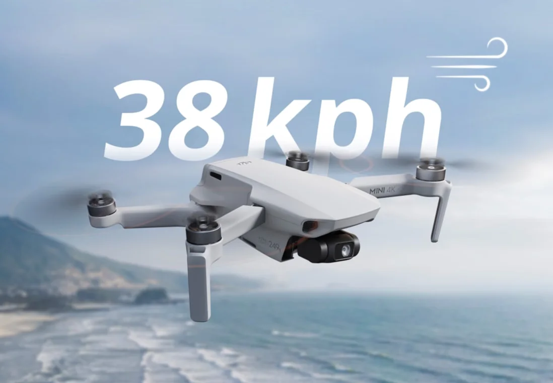 DJI Mini 4K holding steady in wind above a coastline